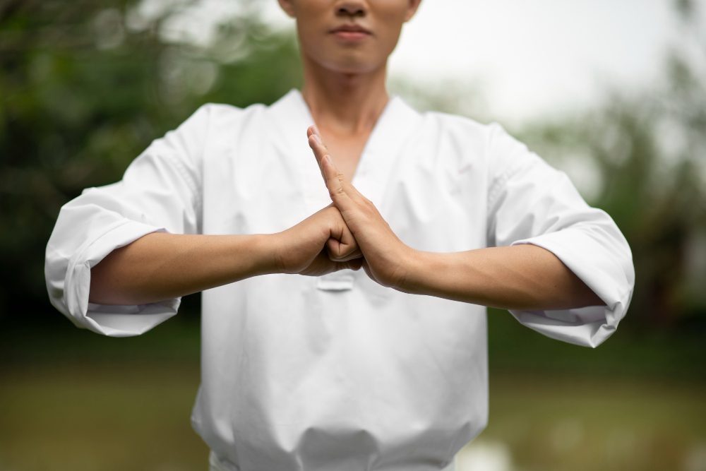 man training taekwondo outdoors nature